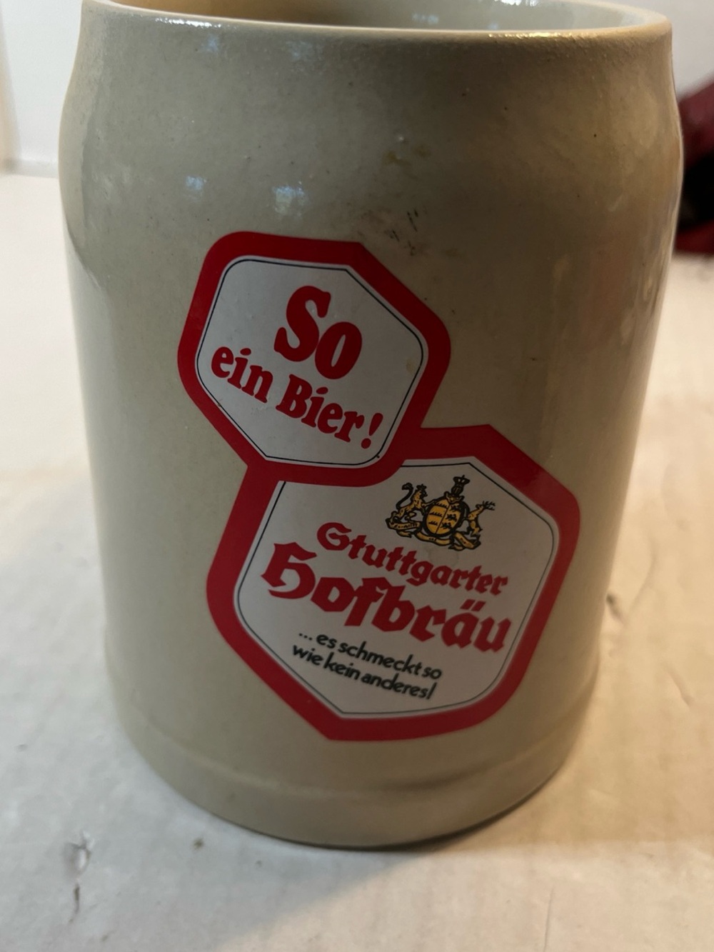 Beige Ceramic Beer Stein with Red Crest